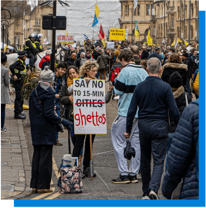 Demonstration. Poster med text: Say no to 15-min cities (överstruket) ghettos